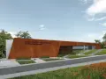 Nowoczesny budynek Muzeum Starożytnego Hutnictwa im. Mieczysława Radwana w Nowej Słupi, z charakterystyczną, rdzawą fasadą.