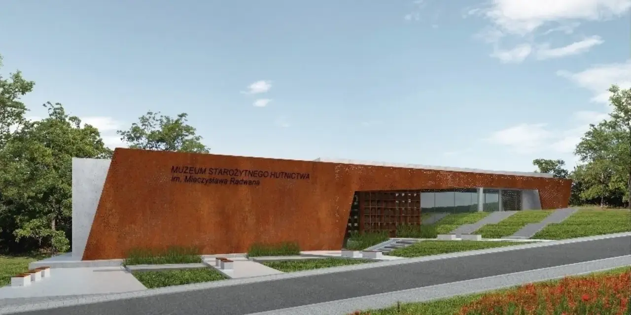 Nowoczesny budynek Muzeum Starożytnego Hutnictwa im. Mieczysława Radwana w Nowej Słupi, z charakterystyczną, rdzawą fasadą.