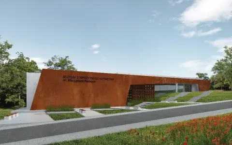 Nowoczesny budynek Muzeum Starożytnego Hutnictwa im. Mieczysława Radwana w Nowej Słupi, z charakterystyczną, rdzawą fasadą.