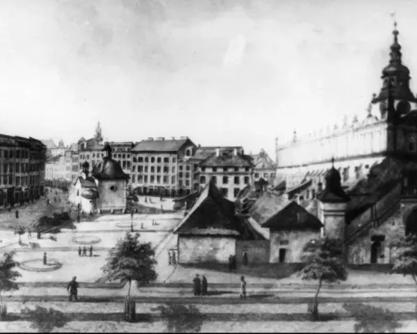 Rynek Główny w Krakowie, z Sukiennicami i Ratuszem. Obraz ukazuje tętniące życiem miasto, które od wieków fascynuje. Ile lat ma Kraków? Tysiąc!
