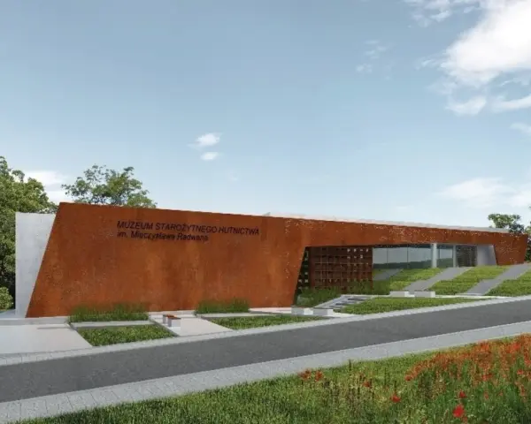 Nowoczesny budynek Muzeum Starożytnego Hutnictwa im. Mieczysława Radwana w Nowej Słupi, z charakterystyczną, rdzawą fasadą.