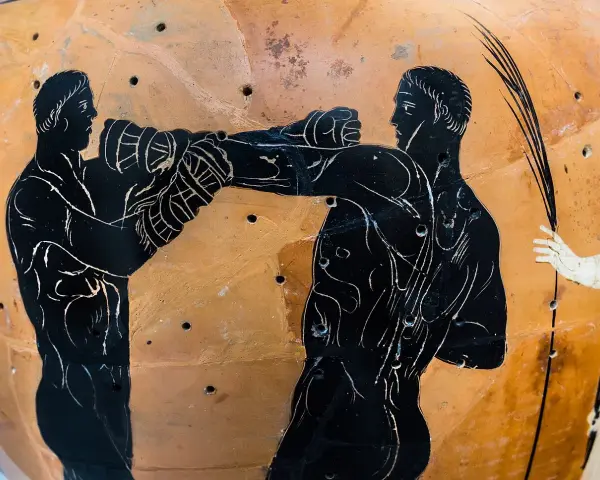 Starożytni Grecy rywalizowali w boksie na igrzyskach olimpijskich. Widok na greckim wazonie.