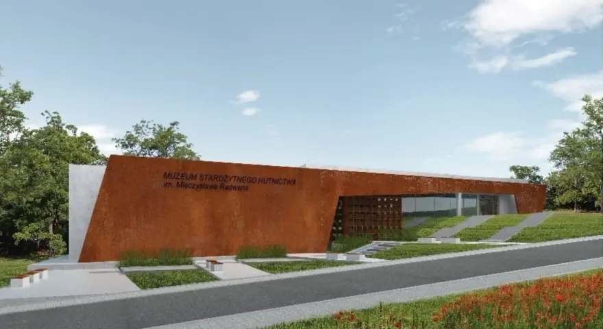 Nowoczesny budynek Muzeum Starożytnego Hutnictwa im. Mieczysława Radwana w Nowej Słupi, z charakterystyczną, rdzawą fasadą.